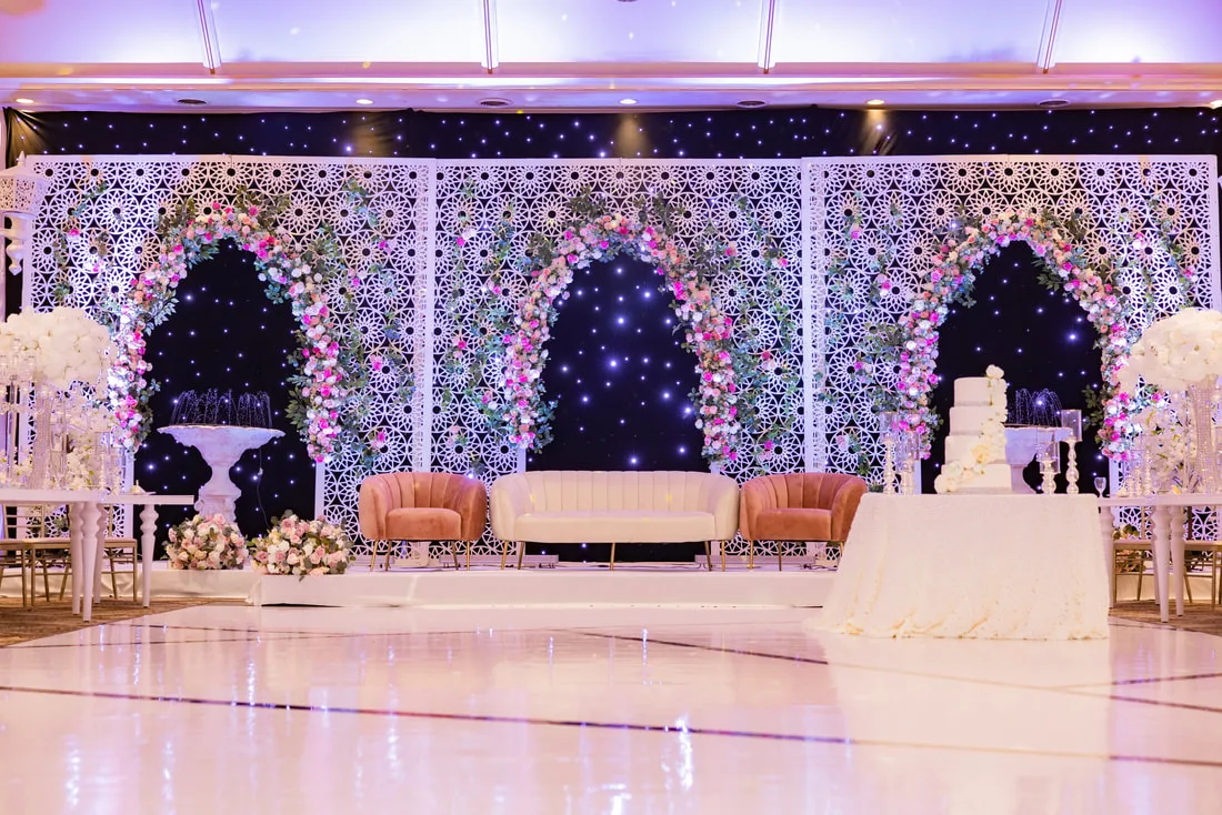 Crystal hall at Sagan Convention Centre with floral arch stage and dance floor